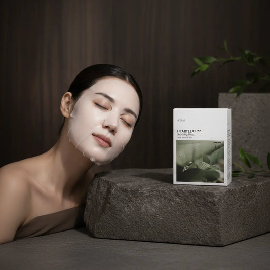 Woman wearing a sheet mask beside a box of 10-pack ANUA Heartleaf Hydrating Sheet Masks.